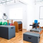 Spacious Pilates studio with modern equipment and vibrant exercise balls.
