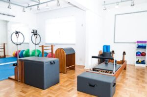 Spacious Pilates studio with modern equipment and vibrant exercise balls.