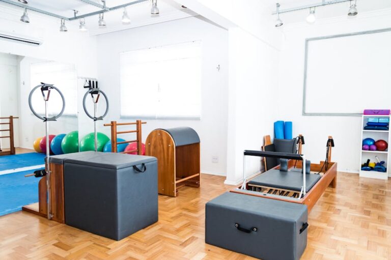 Spacious Pilates studio with modern equipment and vibrant exercise balls.