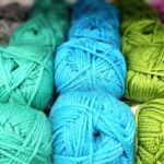 Vibrant yarn balls in various colors ideal for knitting and crochet.