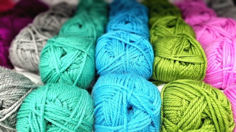 Vibrant yarn balls in various colors ideal for knitting and crochet.