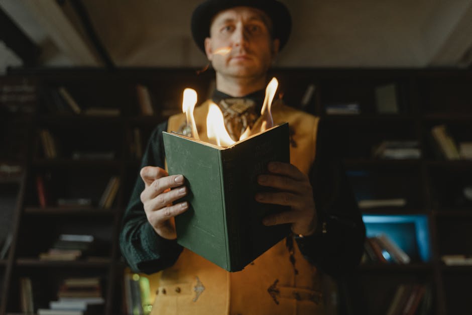 A magician holding a green book engulfed in flames, suggesting magical or mystical themes.