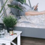 A patient resting in a hospital bed with care essentials nearby, illustrating a calm recovery environment.