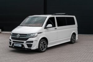 A modern Volkswagen van parked outdoors, showcasing urban style and design.